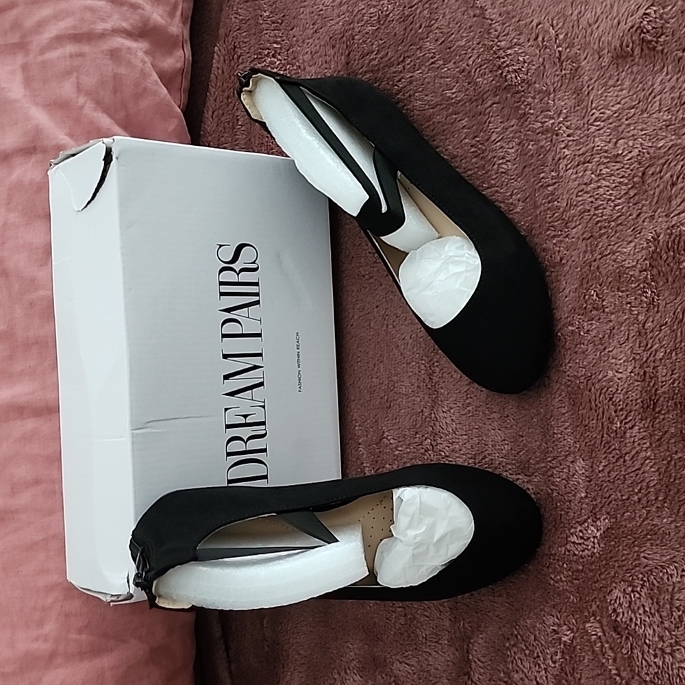 New, never worn black ballet flats with straps.